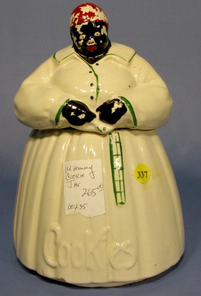 McCoy Mammy Cookie Jar: McCoy Mammy Cookie Jar: marked. (Several chips under skirt edge in front of the word "Cookies". Paint loss to head and hands.) 11" tall All items sell As Is, Where Is, no guarantees of any kind. We ac