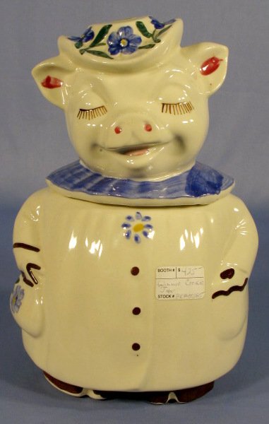 Shawnee Winnie Cookie Jar: Shawnee Winnie Cookie Jar: with blue collar and flowers. No condition problems. 11 1/2" tall All items sell As Is, Where Is, no guarantees of any kind. We accept Mastercard & Visa, no paypal, no perso