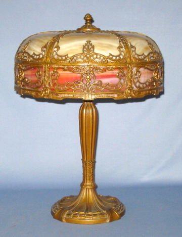 6 Panel Slag Glass & Filigree Table Lamp: 6 Panel Slag Glass & Filigree Table Lamp: glass colors are caramel slag with a band of pink slag glass around the shades bottom. Metal overlay designs of scroll work, columns and leaves with berries. 