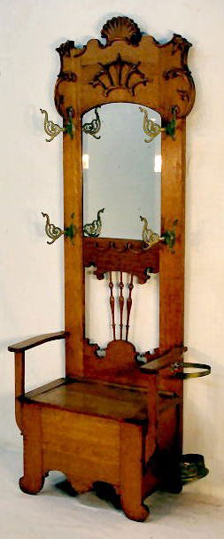 Ornate Antique Oak Hall Tree With Beveled Mirror: Ornate Antique Oak Hall Tree With Beveled Mirror: and umbrella holder, spindle back, four hooks. (Minor roughness as expected. 84" T x 33" W All items sell As Is, Where Is, no guarantees of any kind.