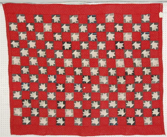 Handmade Quilt of Flower Baskets: Handmade Quilt of Flower Baskets: the framework is red with white spots. There are small squares with flower bunches in each one. (the white back has discoloration and is stained.) 61" x 71" All items