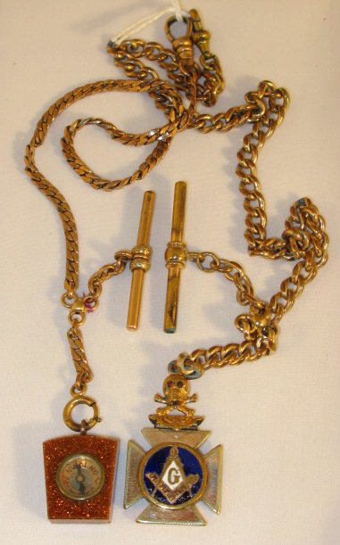 2 Watch Chains: 1 w/Fob, 1 w/Compass: 2 Watch Chains: 1.) Watch chain with Masonic fob. The gold filled chain is fairly thick. The gold colored fob is enameled on both sides and have masonic emblems. The fob is topped with a skull and cro