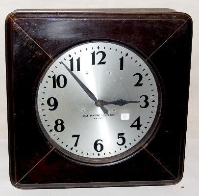 Self Winding Clock Co. N.Y. Square Gallery Clock: Self Winding Clock Co. N.Y. Square Gallery Clock: with a 120 beat brass bob pendulum and a metal 14" dial. The case is mahogany. Wire connections, etc. are inside the case. It is not determined if the