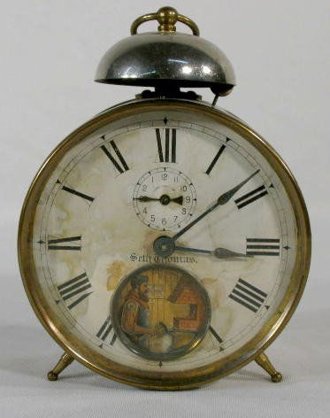 Seth Thomas Alarm With Animated Dial: Seth Thomas Alarm With Animated Dial: fixed key wind with alarm bell on the case's top. The animation is of blacksmith with hammer and anvil. The clock and alarm work; the animation does not. (The dia