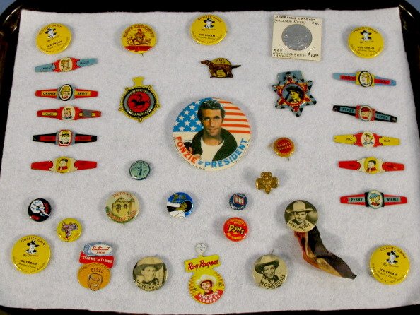 Group of Tin Comic Character Pins, Rings & Coin : Group of Tin Comic Character Pins, Rings & Coin: pins include 4 Hopalong Cassidy Dairy; 2 Gene Autry photo pins, 1 with ribbon; Roy Rogers photo pin, saddle pin, badge; Lone Rang-R pin; Cisco Kid Butt