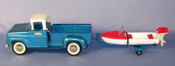Tonka Toy Pickup/Trailer & Plastic Boat 1961: Tonka Metal Pickup/Trailer w/Plastic Boat- 1961: 1.) The blue steel trailer is unmarked, 10 1/2" l. Excellent condition with a bit of wear near the hitch. 2.) The red and white plastic boat is also un