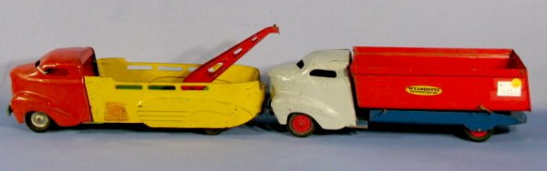 2 Wyandotte Steel Toy Trucks, Wrecker & Dump: 2 Wyandotte Steel Trucks: 1.) Official Wyandotte Service Car Wrecker. Red, yellow and green. 20 1/2" (Mechanism gone from boom, scratched and paint loss.) 2.) Wyandotte Construction Co. Dump Truck. Re