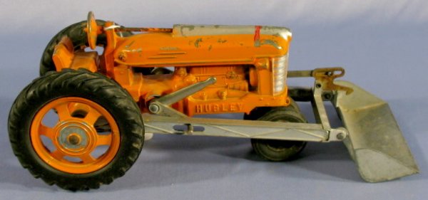 Hubley Tractor w/Front End Loader: Hubley Tractor w/Front End Loader: pot metal and tin. Marked Hubley Kiddie Toy No.500. (Some paint chips and wear.) 11 1/2" All items sell As Is, Where Is, no guarantees of any kind. We accept Masterc