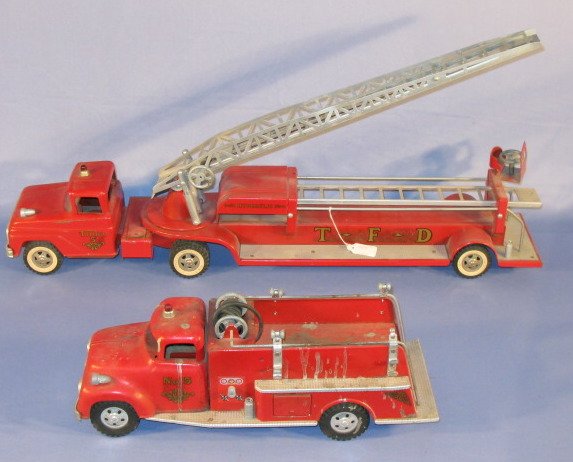 2 Tonka Toys Fire Trucks: 2 Tonka Toys Fire Trucks: 1.) T.F.D. Hydraulic #5 ladder truck with extension. 29" 2.) Tonka #5 pumper truck (Minus parts, both have slight paint loss.) 17" All items sell As Is, Where Is, no guarante