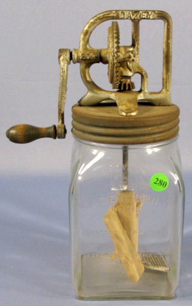 #20 Dazey Churn Jar: #20 Dazey Churn: glass jar with DAZEY cast works on metal lid, wood paddle. (Shows corrosion.) 12" All items sell As Is, Where Is, no guarantees of any kind. We accept Mastercard & Visa, no paypal, no