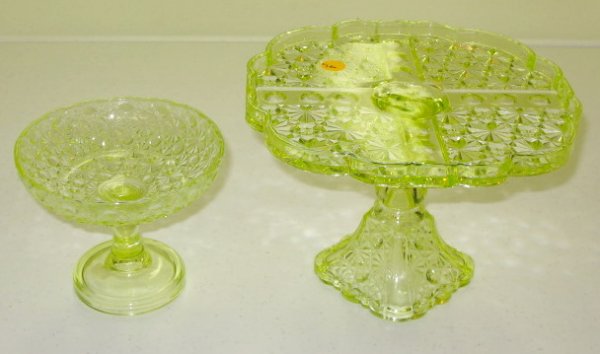 2 Vaseline Glass Cake Plate & Compote: 2 Vaseline Glass Cake Plate & Compote: 1.) Vaseline glass daisy and button cake stand, no condition problems, 7" x 10". 2.) Vaseline glass daisy and button tazza, no condition problems, 5" x 6". All i