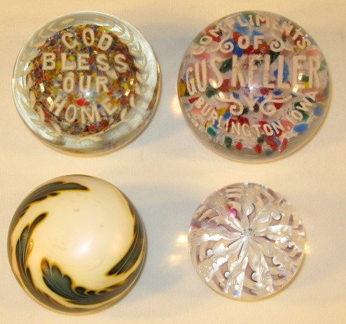 Group of 4 Hand Blown Old Glass Paperweights: Group of 4 Hand Blown Old Glass Paperweights: 1.) Unmarked advertising paperweight; "Compliments of Gus Keller, Burlington, Iowa" in white over a bed of multi colored bits of glass. (Scratches to surf