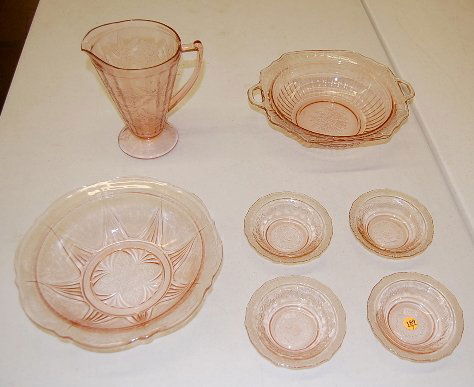 7 pc. Mixed Pink Depression Berry Set, Pitcher: 7 pc. Mixed Pink Depression Berry Set, Pitcher: 1.) Poinsettia water pitcher, no condition problems, 7 1/2" 2.) Floral serving dish, handled with flat rim. (Slight rim roughness.) 11 1/2" w/handles 3.