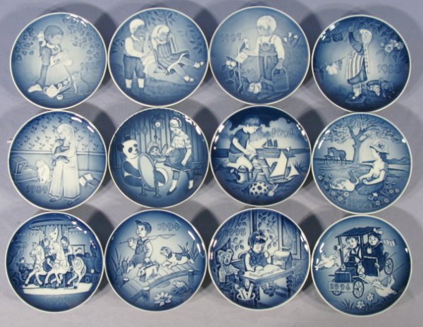 12 B&G Copenhagen Children's Day Plates: 12 B&G Copenhagen Children's Day Plates: 1.) The Magical Tea Party 1985. 2.) A Joyful Flight 1986. 3.) The Little Gardener 1987. 4.) Wash Day 1988. 5.) Bedtime 1989. 6.) My Favorite Dress 1990. 7.) Fu