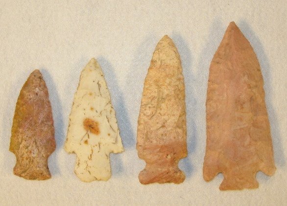 Native American: 4 Projectile Points: Native American: 4 Projectile Points: 1 - pink stone with notches, 4 1/8" L; 2 - white, stemmed 3 1/8" L; 3 - Pink, brown and tan with curved notches, 2 7/8"L; 4 - pink and white with side notches, 3 