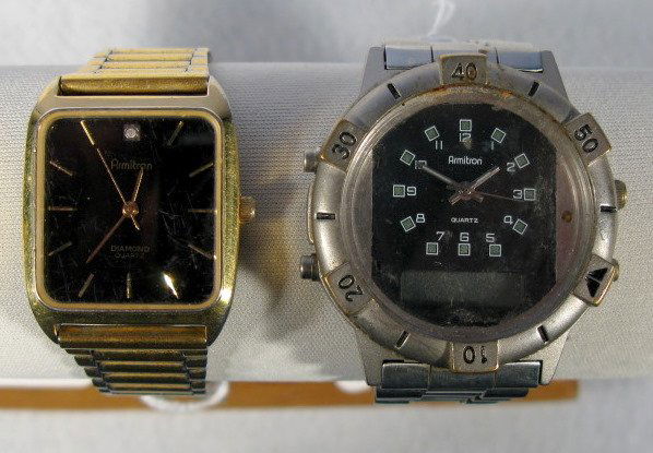 2 Armitron Wrist Watches: 2 Armitron Wrist Watches: 1.) Diamond quartz with black dial, gold markers and a diamond at the 12. Numbered 20/20118A with Japan movement and scratched crystal. 2.) Quartz no.20/2105 stainless steel,