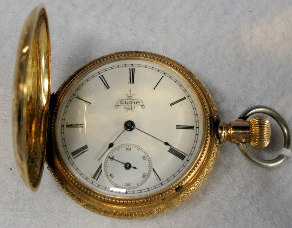Elgin 10S 14K Hunting Case Pocket Watch: Elgin 10S 14K Hunting Case Pocket Watch: serial no.4236913. In an F.W.C. Co. Warranted 14K gold case numbered 46733. The case has nice engraving. (Not running.) 1 5/8" wide All items sell As Is, Where