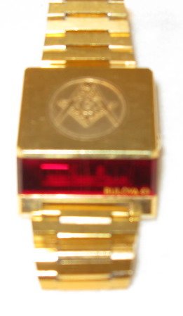 Bulova LED Front Edge Red Dial Wrist Watch: Bulova LED Front Edge Red Dial Wrist Watch: a Masonic emblem is on the top. Base metal and steel. Marked N7 for 1975. These are estate watches that have been stored for up to 30 years; we found them i