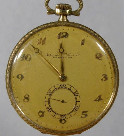 I.W. Co. Schaffausen 14K 16S Pocket Watch: International Watch Co. Schaffausen 14K 16S Pocket Watch: open face; serial no.900512. Swiss made with gold dial, hands and numbers. Stem wind. The yellow 14K gold hinged case is 1 15/16" wide. It is 