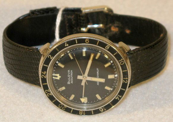 Bulova Accutron 214 Astronaut Model Wrist Watch: Bulova Accutron 214 Astronaut Model Wrist Watch: with black face and luminous hands and digits. Numbered 1-612917, circa 1968. Stainless steel. These are estate watches that have been stored for up to