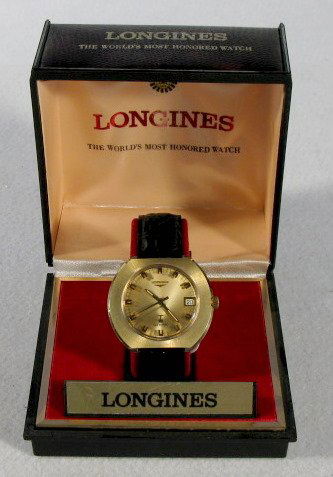 Longines Ultronic Wrist Watch in Box: Longines Ultronic Wrist Watch in Box: gold front with day wheel at the 3. Circa 1970's. In original box. These are estate watches that have been stored for up to 30 years; we found them in drawers and
