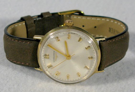 Longines 14K Wrist Watch: Longines 14K Wrist Watch: back marked also, Use All Proof 1225 Wrench. Silver dial with gold hands and numbers. Not opened. (The bracelet is damaged.) Running at this time. These are estate watches th
