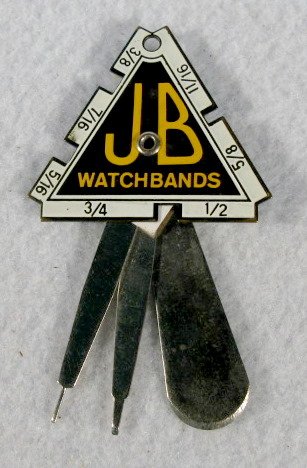 JB Watch Bands Gauge Tool: JB Watch Bands Gauge Tool: triangle shape with number sizes and attached watch tools. Made in Japan. About 3" long All items sell As Is, Where Is, no guarantees of any kind. We accept Mastercard & Vis
