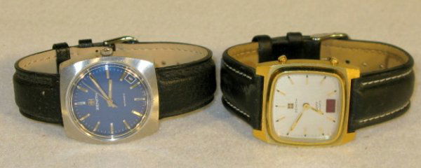 2 Zenith Wrist Watches: 2 Zenith Wrist Watches: 1.) Stainless steel with blue dial and silver features with day between 4 and 5. Circa 1970's. Running at this time. 2.) Defy Quartz with square silver dial and gold features.