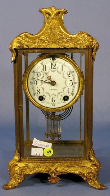 Seth Thomas Empire #12 Crystal Regulator: Seth Thomas Empire #12 Crystal Regulator: time and strike, floral porcelain dial. (Left side glass damaged at the base. Re-gilded case and oxidized.) 14 1/2" All items sell As Is, Where Is, no guarant