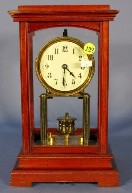 Gustav Becker Torsion Cabinet Clock: Gustav Becker Torsion Cabinet Clock: mahogany and beveled glass, porcelain dial. (Damage to top case.) 12 1/2" t x 7 1/2" w All items sell As Is, Where Is, no guarantees of any kind. We accept Masterc