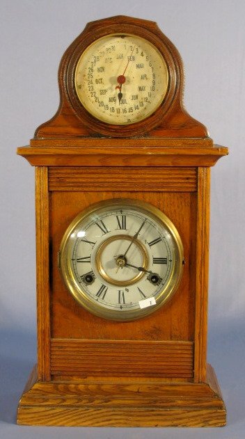 Jerome & Co. Cabinet Clock w/Perpetual Calendar: Jerome & Co. Cabinet Clock w/Perpetual Calendar Top: oak case, metal dial, pendulum. (Has paint loss. The calendar dial is worn and stained.) 18 1/2" t x 8" w All items sell As Is, Where Is, no guaran