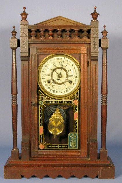 New Haven Vistula Calendar Parlor Clock: New Haven Vistula Calendar Parlor Clock: 8 day, time and strike, black walnut case. (Metal dial has minor wear, some nicks to case. Needs cleaned.) 23" All items sell As Is, Where Is, no guarantees of