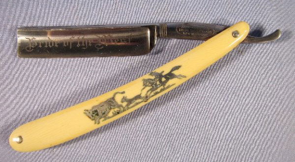 Jack Knife Ben "Pride of the West" Straight Razor: Jack Knife Ben "Pride of the West" Straight Razor: the silver inlaid celluloid handle shows a cowboy, dog and cow. Marked Union Stock Yards, Made in Germany. Overall excellent condition. No case. 6 1/