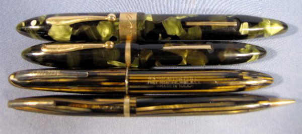 3 Sheaffer Pens & 1 Pencil: 3 Sheaffer Pens & 1 Pencil: 1.) Balance pen, green and black mottled hard plastic, lever fill with 14K ball clip and engraved band. With Everlast nib.5 1/2" long 2.) Smaller hard plastic lever fill wi