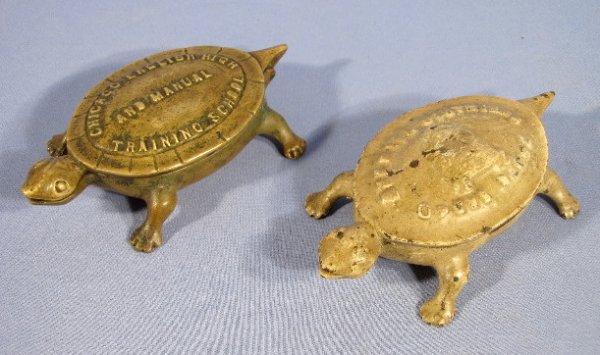 2 Turtle Match Holders, Brass & Cast Iron: 2 Turtle Match Holders, Brass & Cast Iron: 1.) The brass turtle is hinged at the tail and has this wording on the top- "Chicago English High and Manual Training School". Inside the shell is this in re