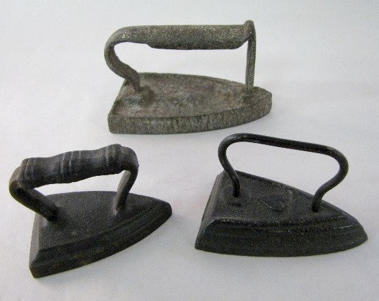 3 Sad Irons- Toy Size, Cast Iron: 3 Sad Irons- Toy Size, Cast Iron: 1.) With a heart emblem and heavy wire handle, 3" 2.) With horizontal lines on the handle, 2 1/2" 3.) rough cast with non legible figure on the top, 4". All are old a