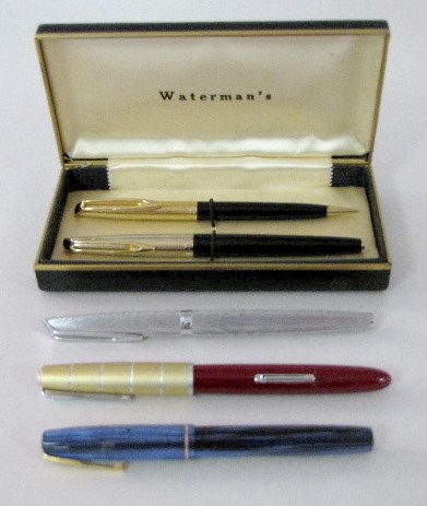 Waterman's Pens & Pencils: Waterman's Pens & Pencils: 1.) Lady Stateleigh Taperite, lever filling. Maroon plastic with aluminum cap and 14K nib. 2.) An individual and 2 pc. boxed set of c/f cartridge filled. The boxed pen has a