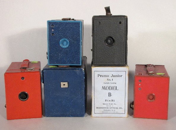 4 Cameras, Brownie, Rainbow & Premo: 4 Cameras: all are box type. 1.) Blue Brownie in original box. 2.) Red Brownie No.2 3.) Red Rainbow Hawk-Eye No.2, model 6. 4.) Premo Junior No.1, model B. (All in used condition.) All items sell As I