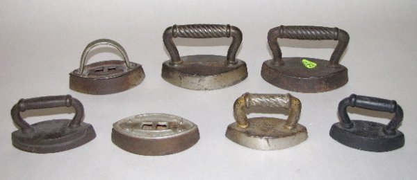 7 Cast Iron Sad Irons, Toy & Small Size: 7 Cast Iron Sad Irons: all are solid cast iron. (1 has a replaced handle; 1 is missing a handle.) 3" to 4 3/8" long All items sell As Is, Where Is, no guarantees of any kind. We accept Mastercard & Vi