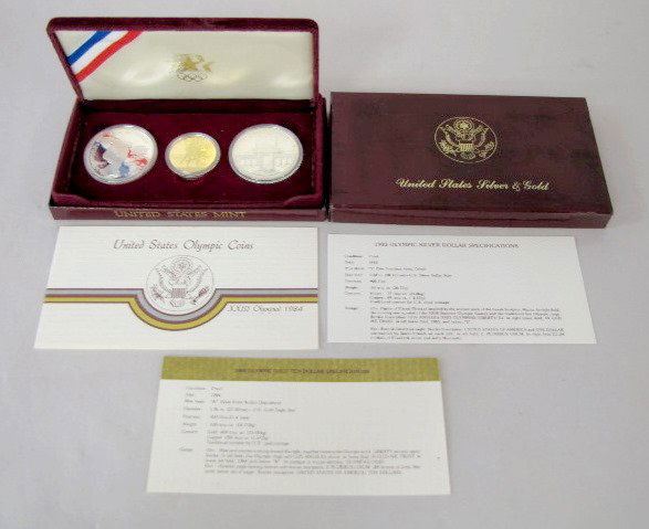 U.S. 1984 Olympics Gold & Silver Set: U.S. 1984 Olympics Gold & Silver Set: the 3 coins are a 1984W 10 dollar gold coin; 1983 and 1984 silver dollars. All in original packaging. All are proof condition. All items sell As Is, Where Is, no