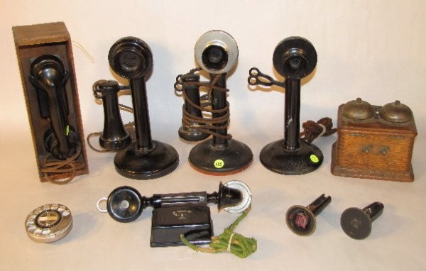 5 Old Telephones, Stick & Cradle: 5 Old Telephones, Stick & Cradle: 3 stick phones are Western Electric, circa 1915. Each is a little different than the other. (One is missing a receiver.) A black wall phone by unknown make is cracked