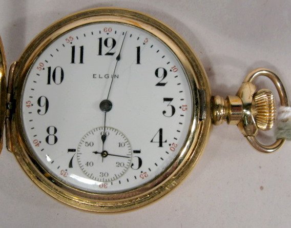 Elgin 15J 6S Grade 216 Hunting Case Pocket Watch: Elgin 15J 6S Grade 216 Hunting Case Pocket Watch: serial #8860653, engraved Dueber special hunting case with cross on front & back. (Not running.) 1 5/8" wide All items sell As Is, Where Is, no guaran