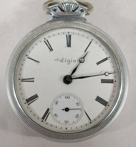Elgin 7J 18S Grade 288 OF Pocket Watch: Elgin 7J 18S Grade 288 OF. Pocket Watch: serial #12802978, 1907. Running at this time. (Crystal scratches & case wear.) 2 1/8" wide All items sell As Is, Where Is, no guarantees of any kind. We accept