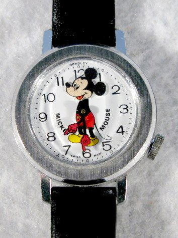 Mickey Mouse Wrist Watch, Swiss Made: Mickey Mouse Wrist Watch, Swiss Made: he is shown on the dial with animated head and arms as time indicators. Running at this time. All items sell As Is, Where Is, no guarantees of any kind. We accept