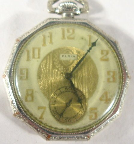 Elgin 17J 12S Grade 477 OF Pocket Watch: Elgin 17J 12S Grade 477 OF Pocket Watch: 1925, serial #27399312, decagon, 14K gold filled engraved case. (Discolored dial and back dents.) 1 13/16" wide and running at this time. All items sell As Is,