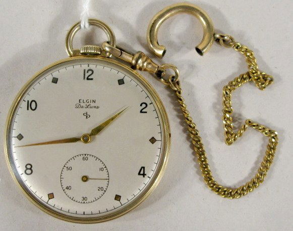 Elgin 542 Deluxe 17J 14S OF G.F. Pocket Watch: Elgin 542 Deluxe 17J 14S OF G.F. Pocket Watch: serial no.L474607, in a yellow Wadsworth snap on case numbered E718038. (The case has that pocket caused buffed look.) 1 11/16" wide and running at this