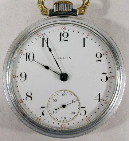 Elgin 7J 18S Grade 288 Pocket Watch: Elgin 18S Grade 288 Pocket Watch: 1912, serial #16806470, open face Illinois watch case, train engraved on back. No condition problems. 2 1/8" wide and running at this time. All items sell As Is, Wher