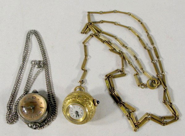 2 Ladies Neck Chain Watches-Hebros & Bucherer: 2 Ladies Neck Chain Watches: 1.) Hebros 62 Swiss 17J Ball Watch on 28" neck chain. Fancy engraved case. 7/8" wide (Wants to run, but will not continue to run.) 2.) Bucherer 17J Ball Watch on 18" chain