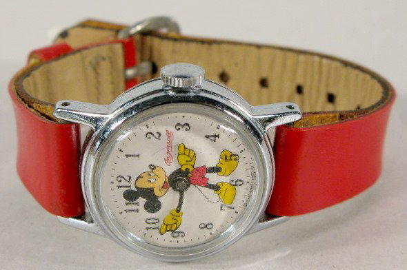 Ingersoll Mickey Mouse Wrist Watch, 1955: Ingersoll Mickey Mouse Wrist Watch, 1955: round dial; with red strap; pin lever movement. All items sell As Is, Where Is, no guarantees of any kind. We accept Mastercard & Visa, no paypal, no personal