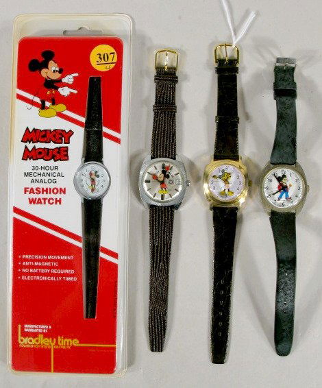 4 Mickey Mouse Wrist Watches: 4 Mickey Mouse Wrist Watches: 1.) Bradley 30 hour in case. 2.) Helbros W Germany with day and date, W.D.P. 3.) Swiss movement, Hong Kong. 4.) 1970 Adorable Sales All items sell As Is, Where Is, no gua